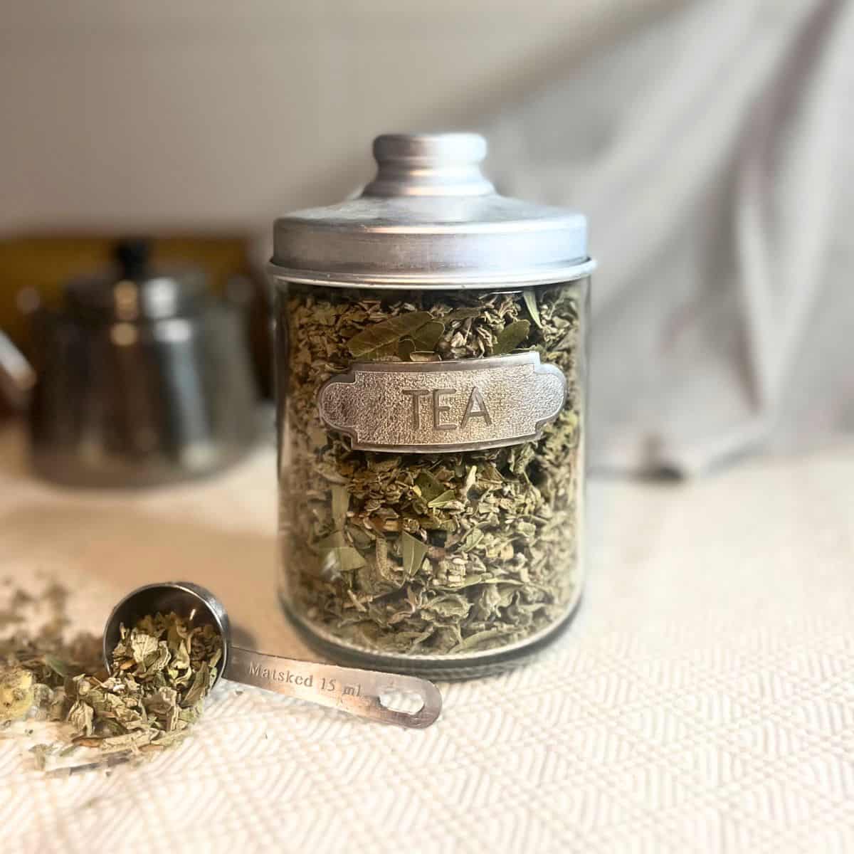 A homemade winter tea mix in a glass jar.