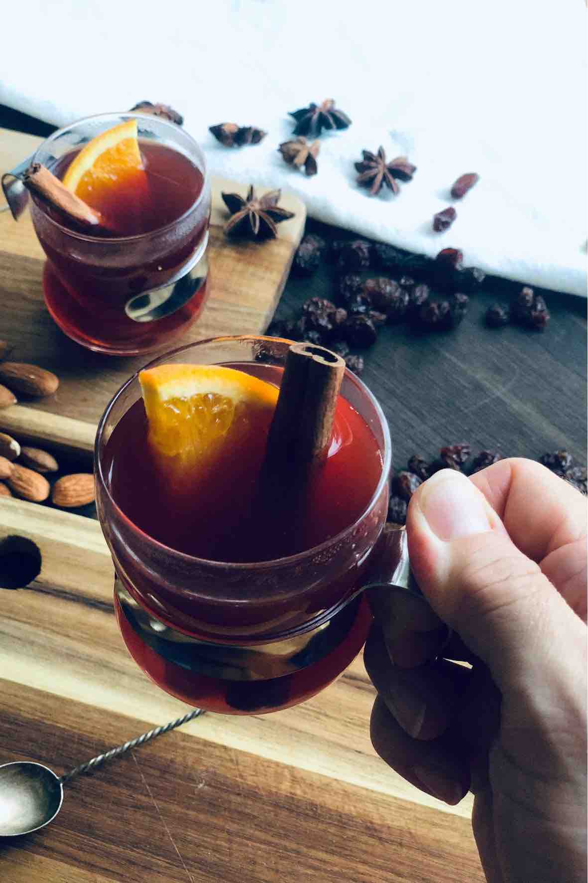 A hot Danish glogg with a orange slice in the glass.