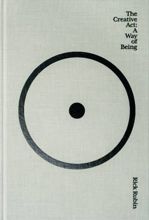 Book cover of 'The Creative Act: A Way of Being' by Rick Rubin, featuring a minimalist design with a black circle containing a single dot on a textured light gray background