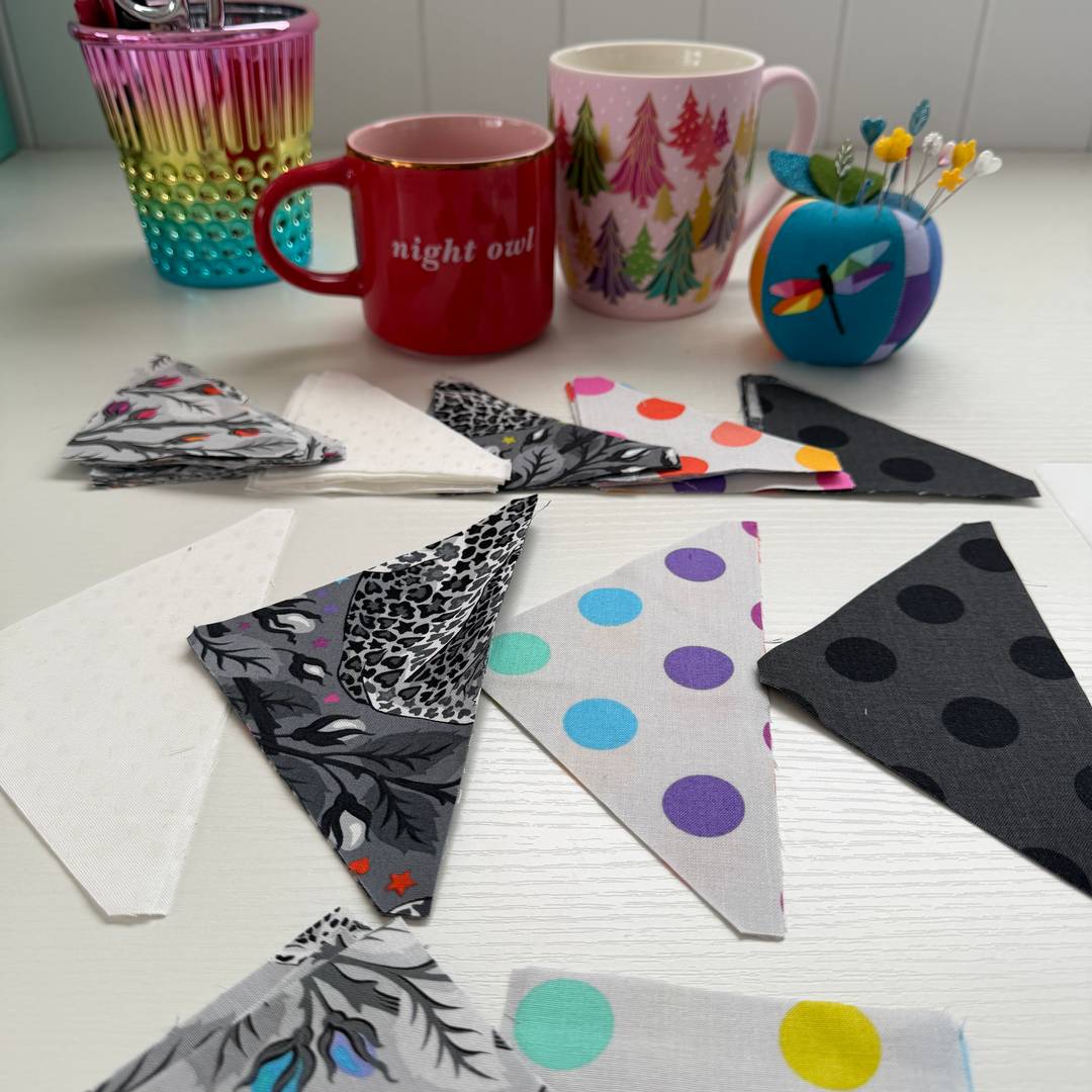 pre cut fabric pieces in Tula Pinks Graywork fabric laid out ready to sew