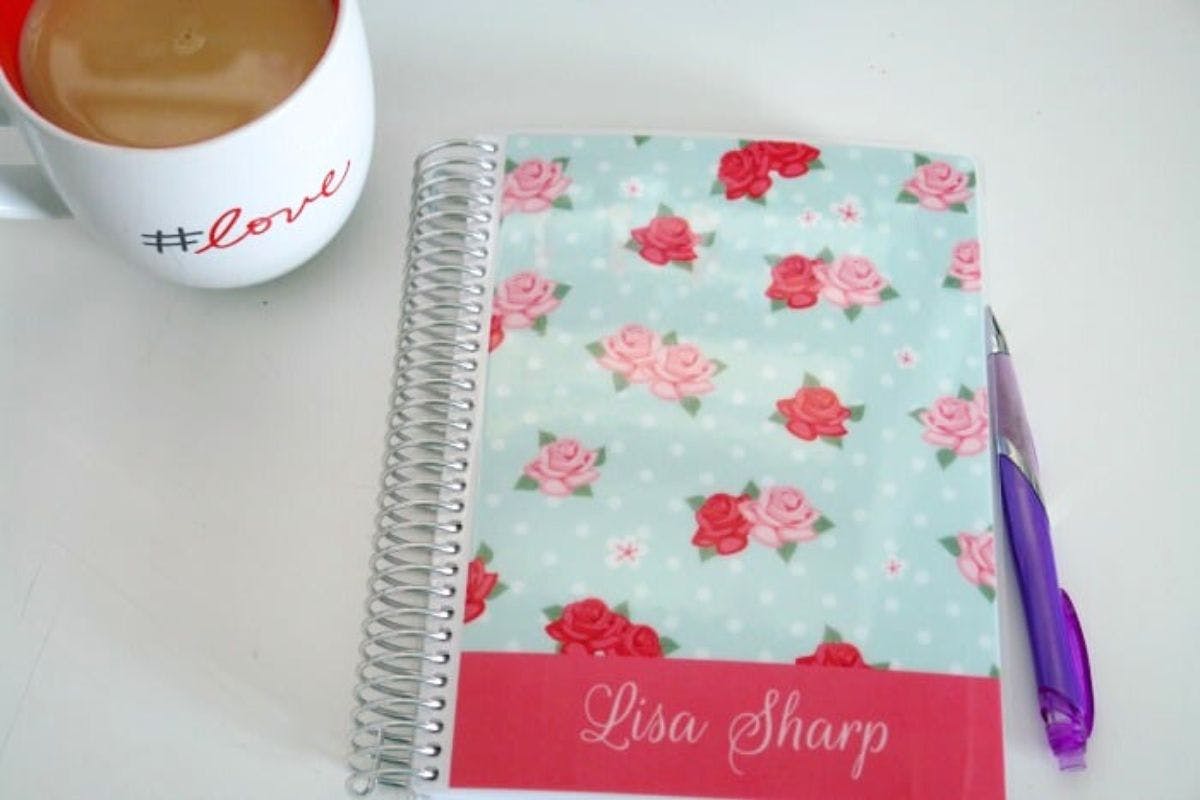 planner and cup of tea on desk