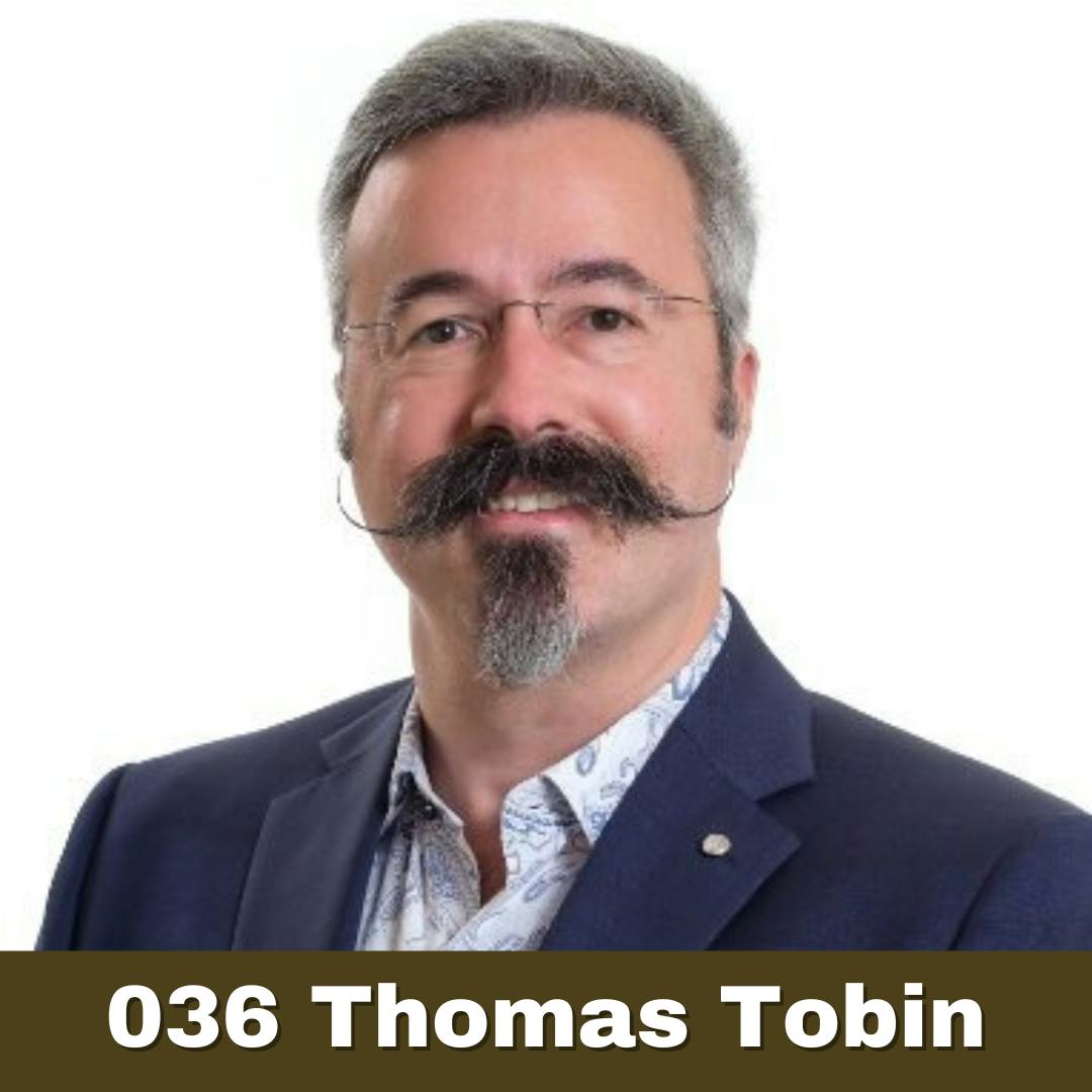 Headshot of Tom Tobin with his epic mustache and the text "036 Thomas Tobin"