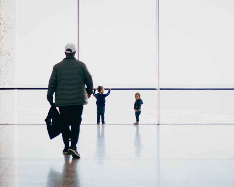 A group of people walking through an airport