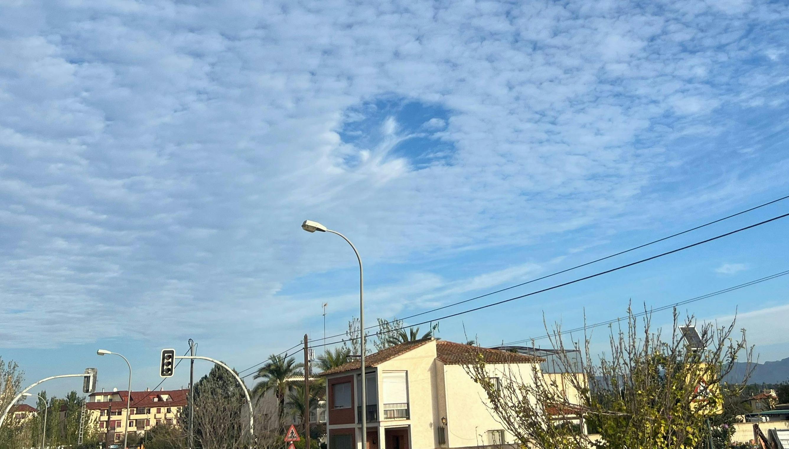 A fallstreak hole appearing in the sky.