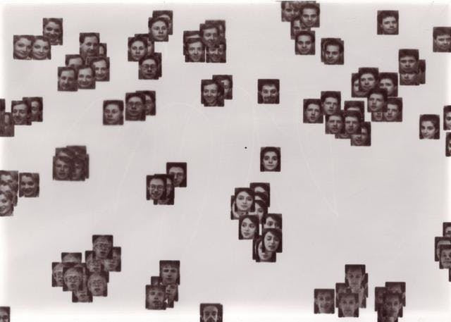 A laptopogram based on a neutral background and populated by scattered squared portraits, all monochromatic, grouped according to similarity. The groupings vary in size, ranging from single faces to overlapping collections of up to twelve. The facial expr