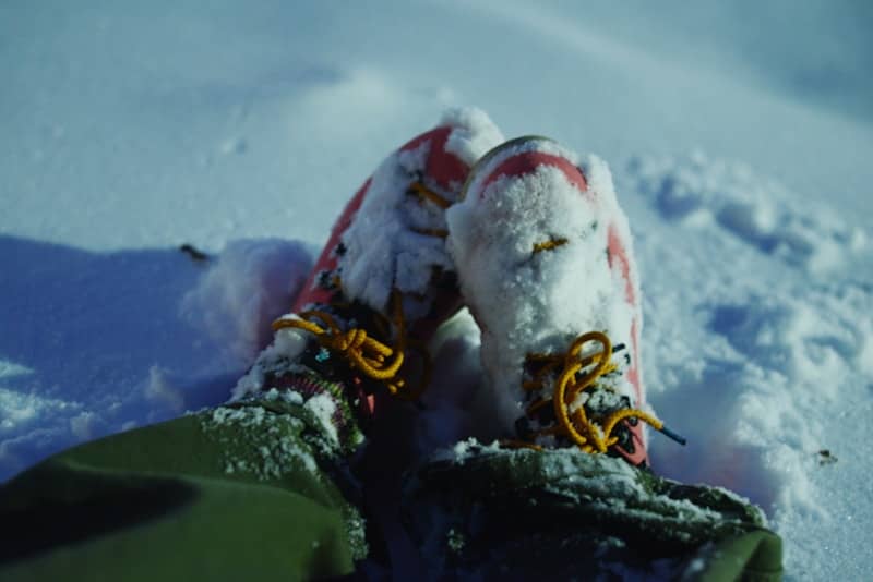 Boots covered in snow in a winter landscape
