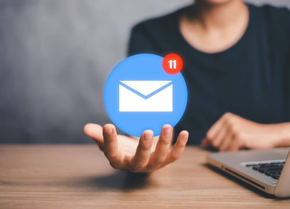 Hand with email inbox representing email list