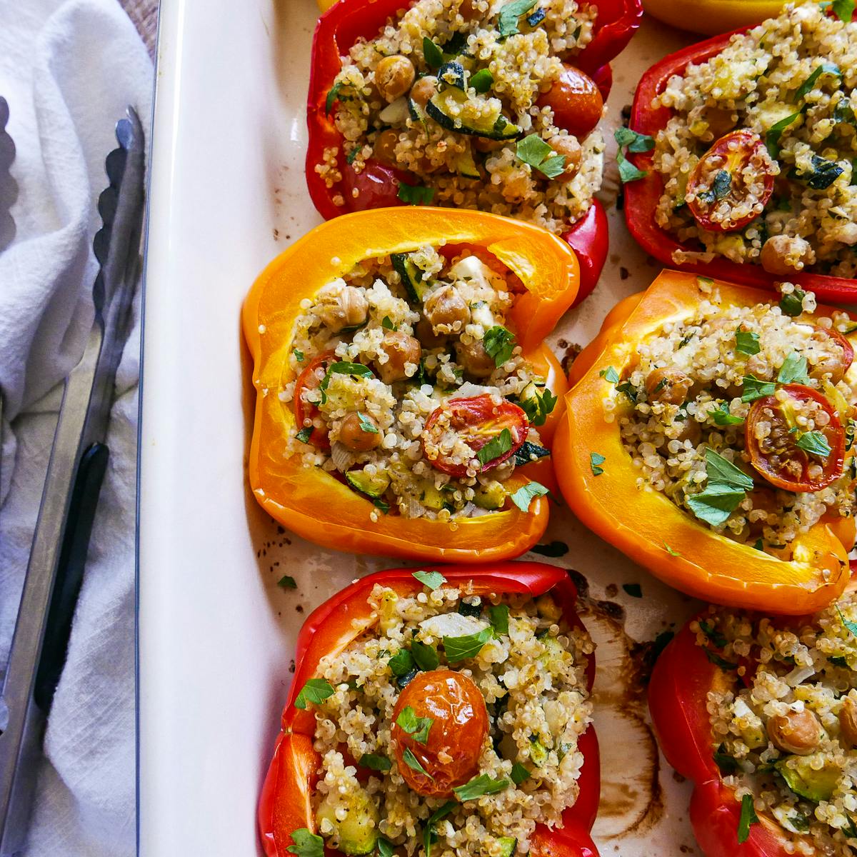 Vegetarian stuffed peppers baked in a large baking dish.