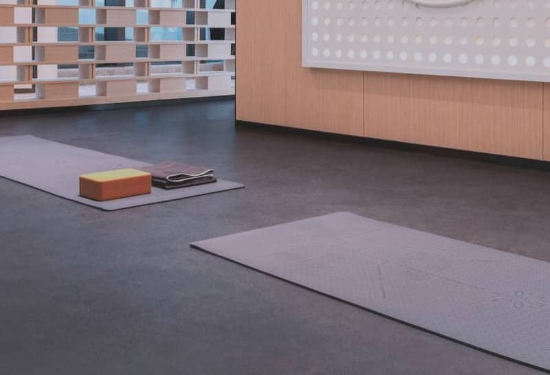 Yoga mats and props in a modern studio.