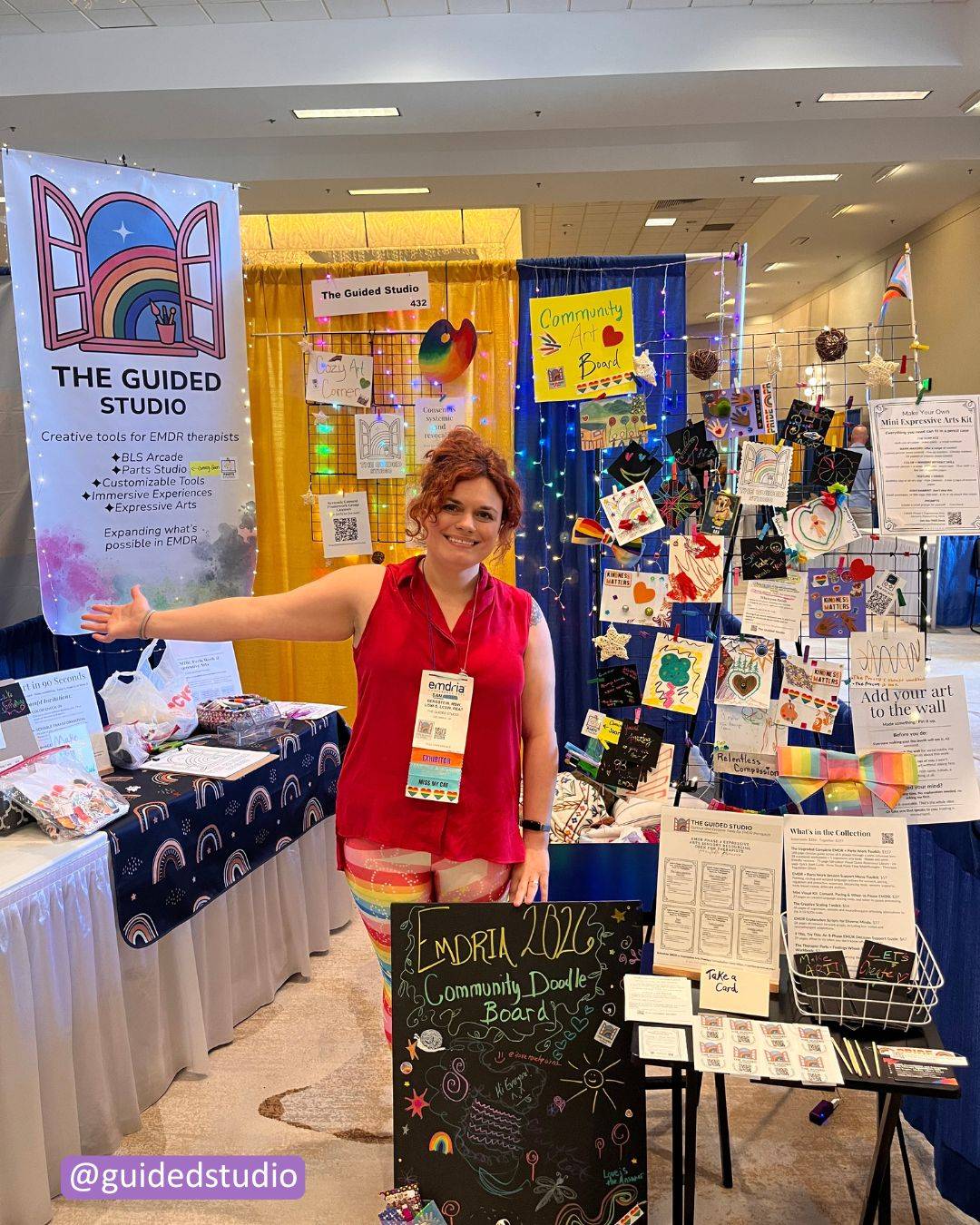 an image of Sam Bergstein at her EMDRIA booth for the Guided Studio with tools for EMDR, parts work and expressive arts therapy including BLS Arcade