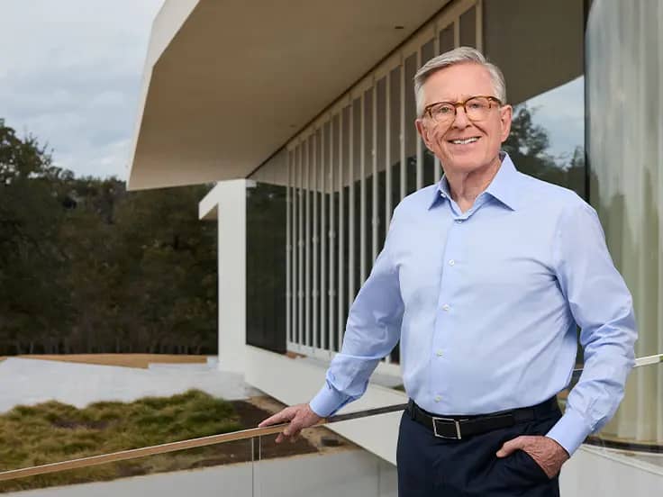 Photo of author David Booth in front of his residence in Austin, Texas.