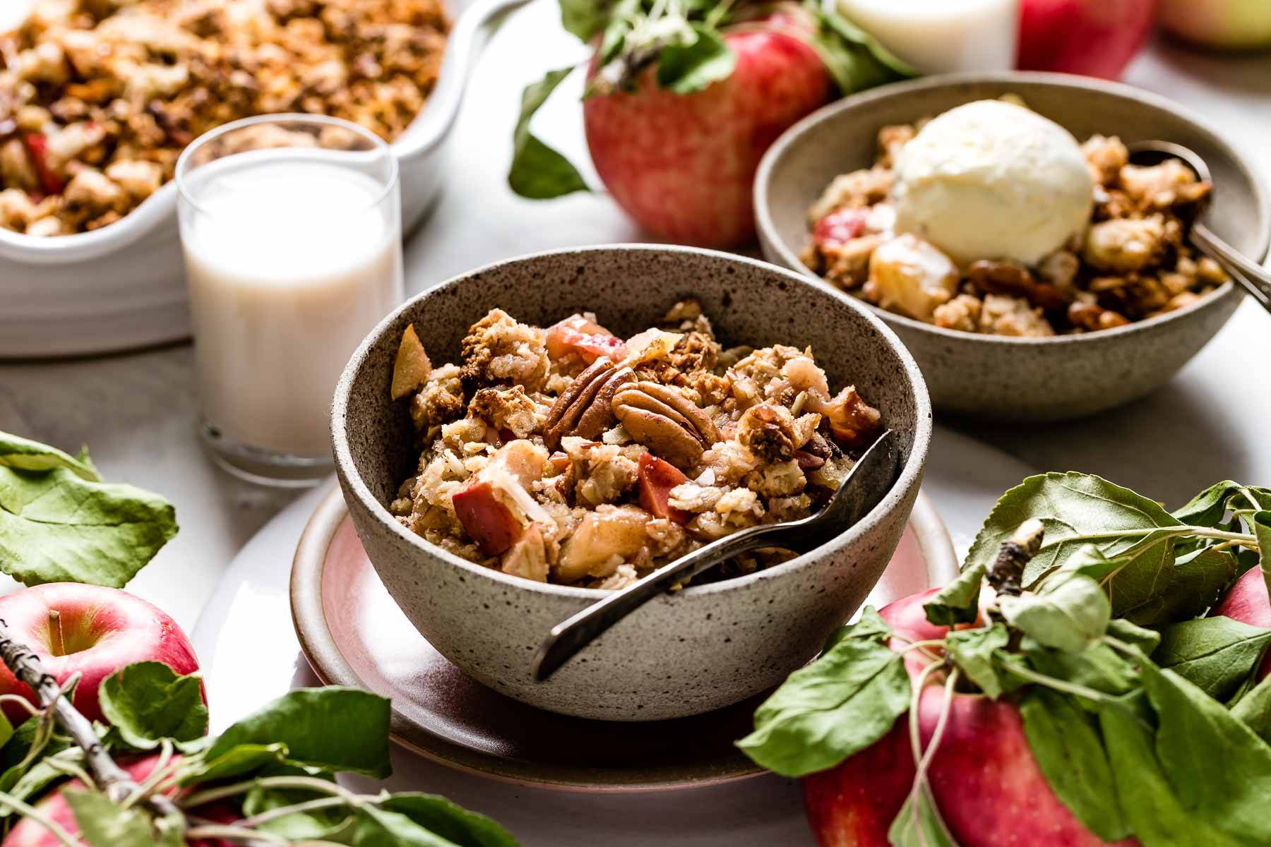 Apple crisp with a glass of milk on the side.
