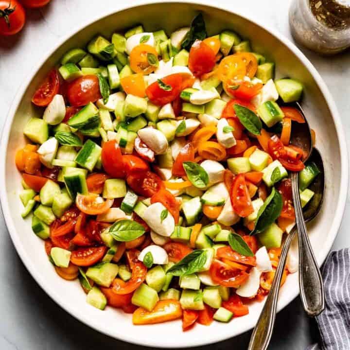 Tomato cucumber mozzarella salad in a big bowl