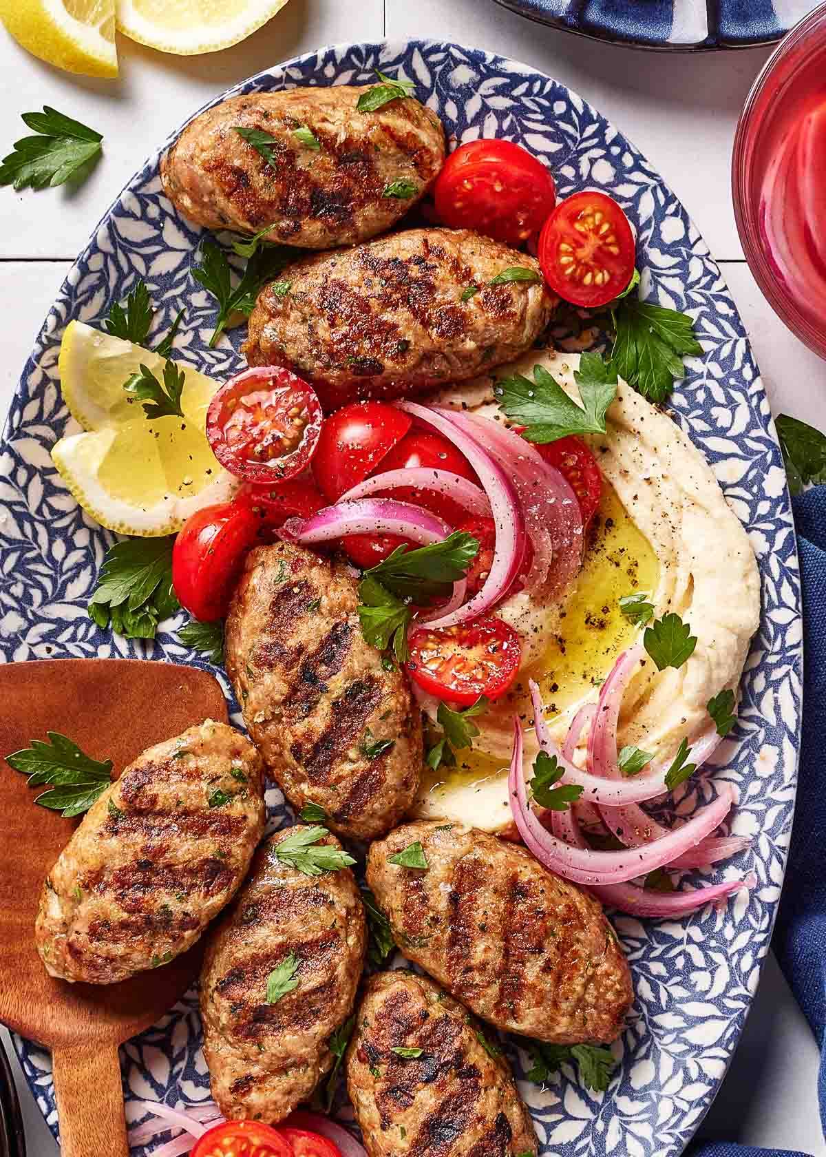 Chicken kofta on a bed of hummus.