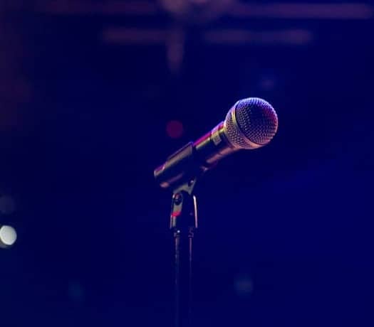 black and gray microphone on black stand