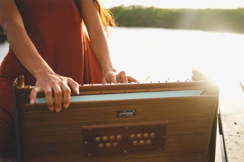 woman in orange sleeveless dress