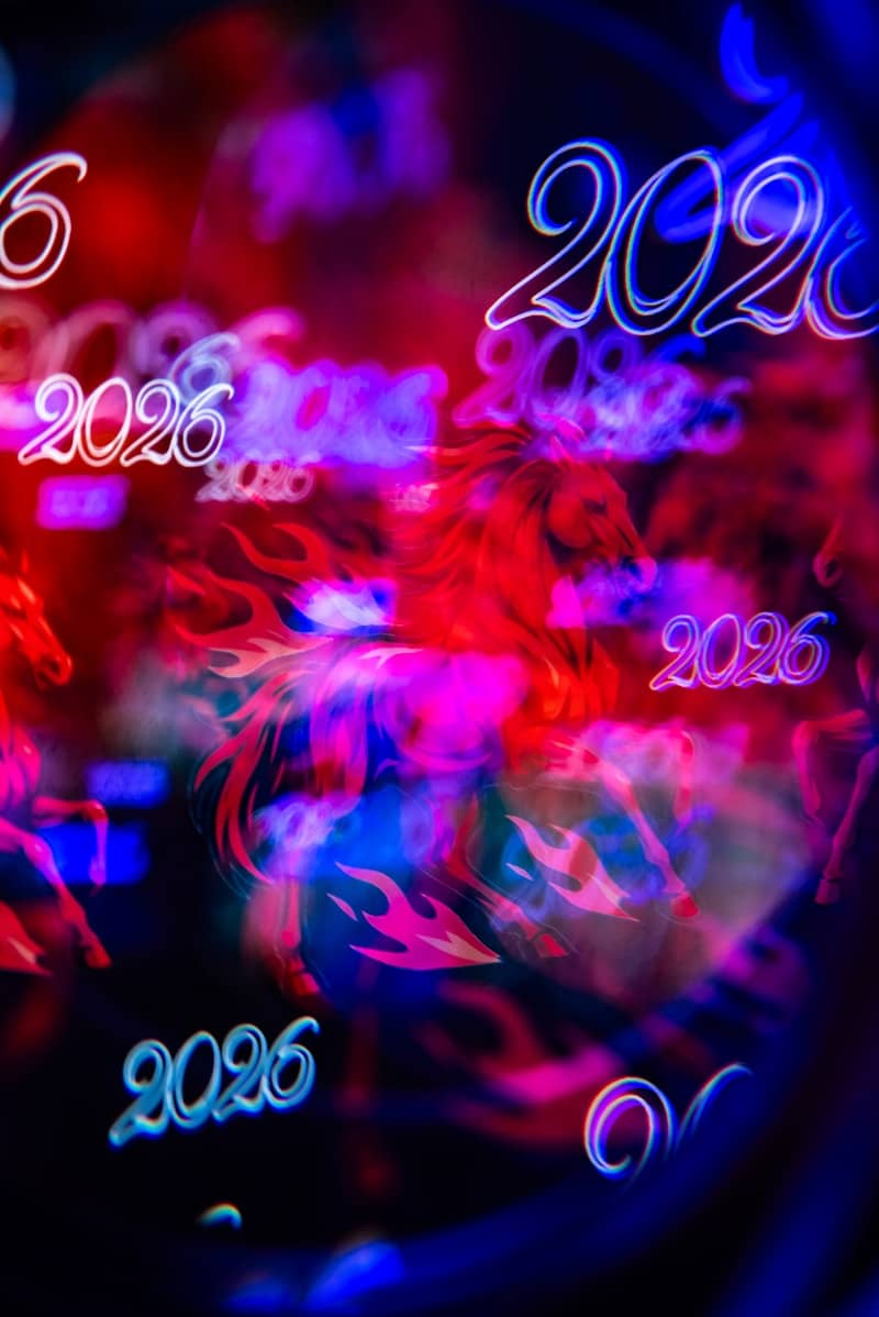 Abstract glowing numbers and horses on dark background