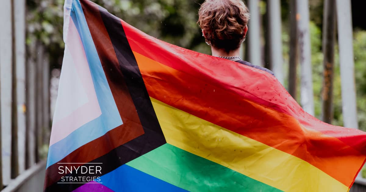 person with a pride flag