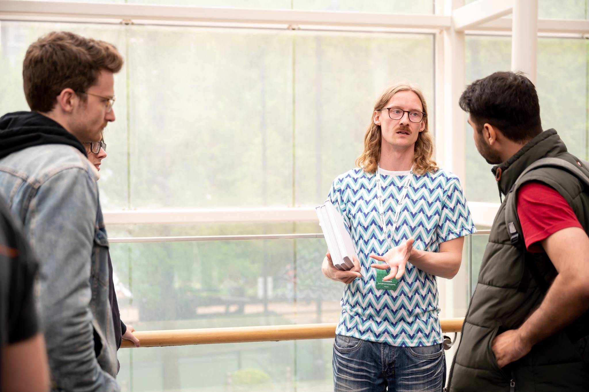 Michael talking to other conference attendees after his talk at Vue London.