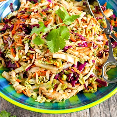 Thai chicken slaw salad in a colorful bowl.