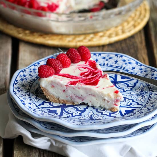A piece of frozen yogurt pie on a plate.