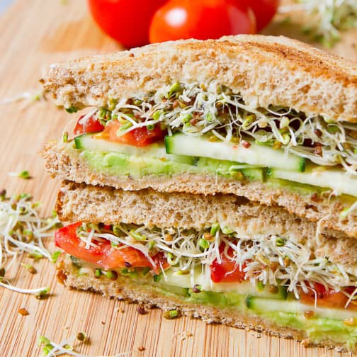A sandwich filled with vegetables.