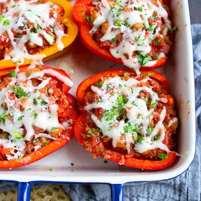 Vegetarian stuffed peppers in a baking dish.