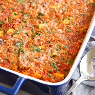 Zucchini, turkey and rice casserole in a baking dish.