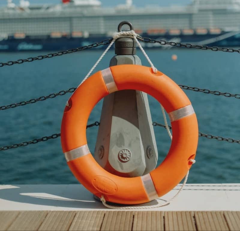 A life preserver sitting on the deck of a boat