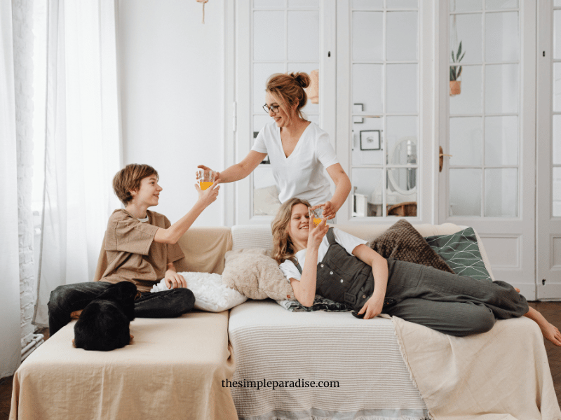 mom with son and daughter on the couch