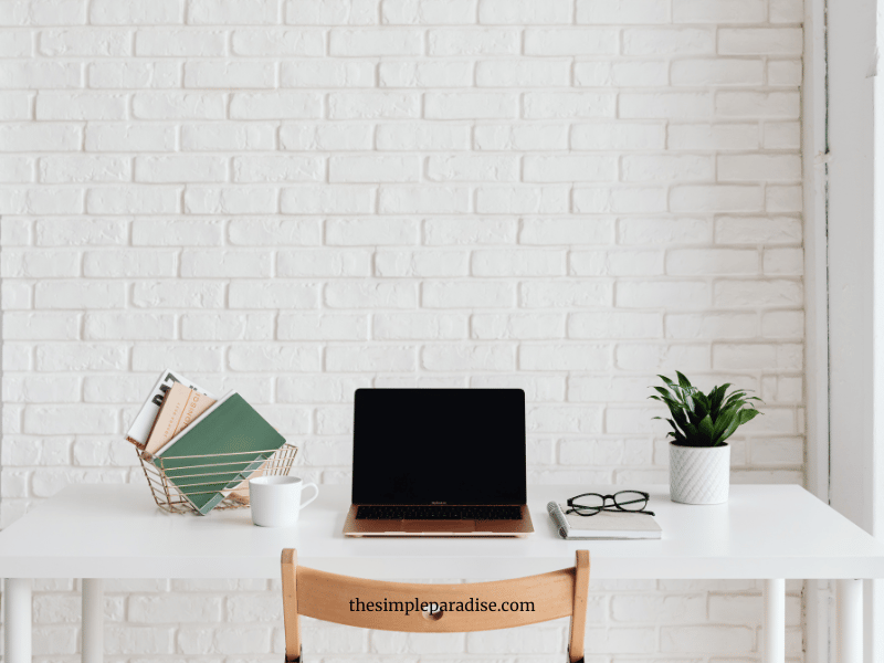 Minimalist desk with laptop and other office accesories