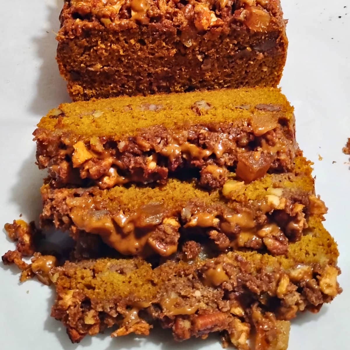 a photo of  maple pumpkin cake with apple, pecan and ginger streusel