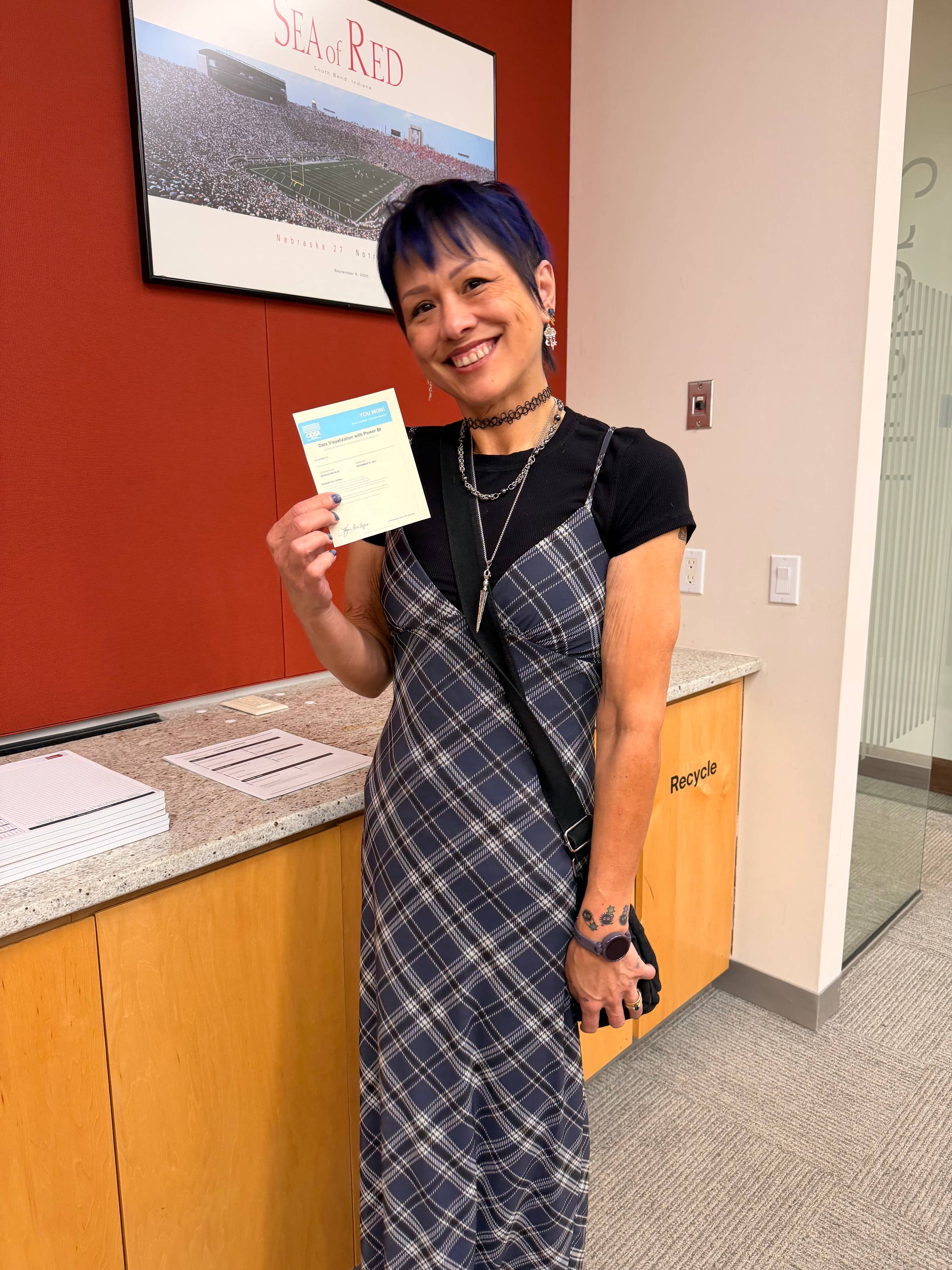 One winner holding their gift certificate! 