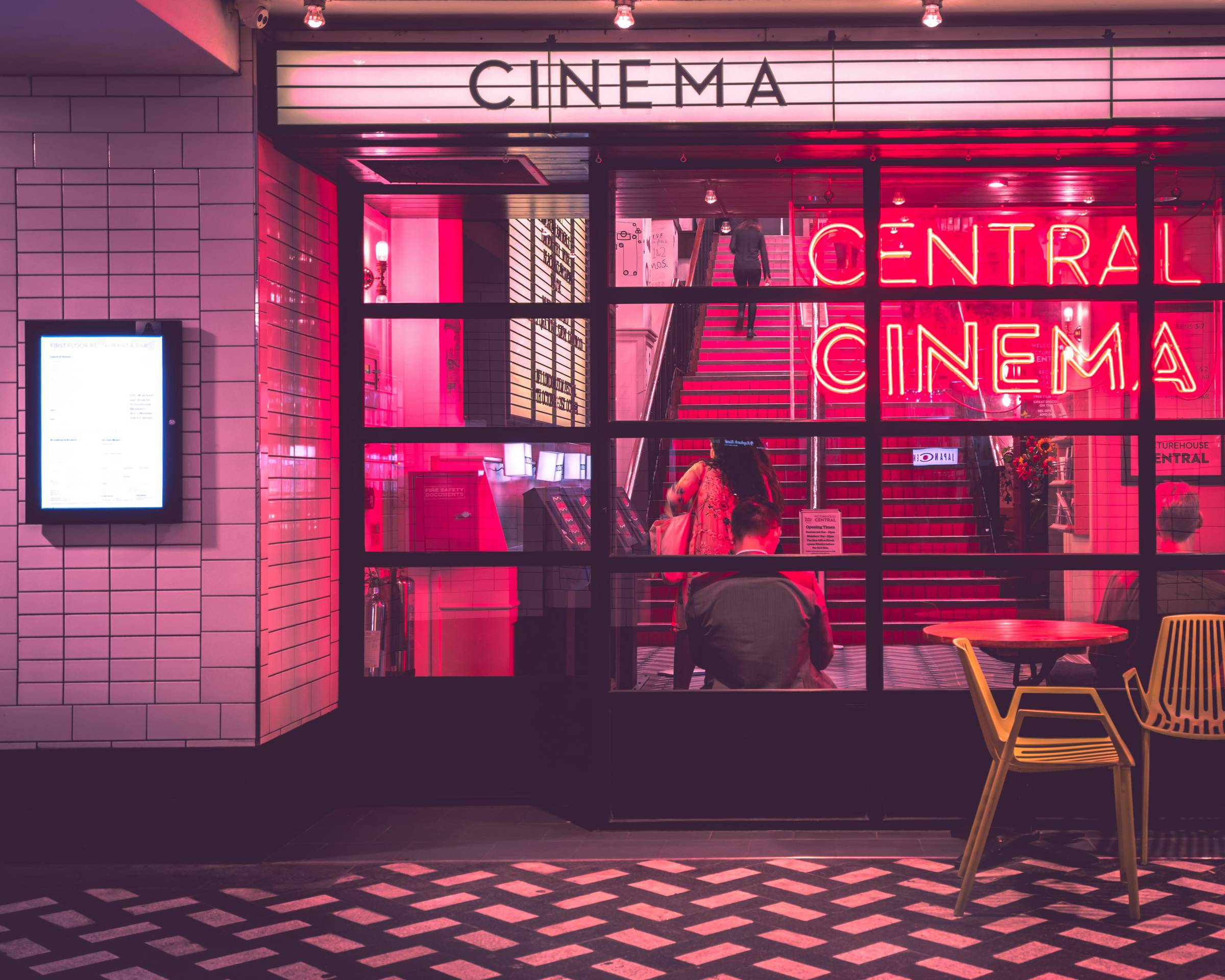 A blurry photo of people in a movie theater