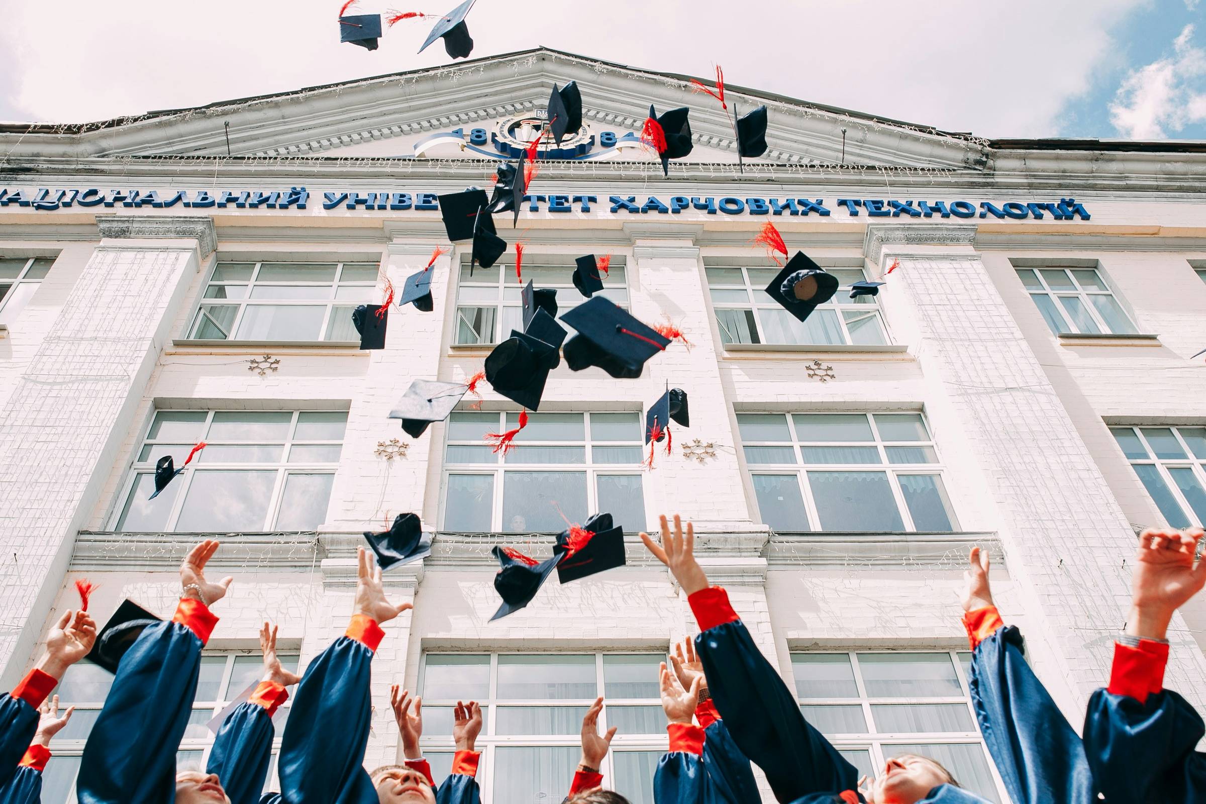 A group of people in graduation gowns and hats
