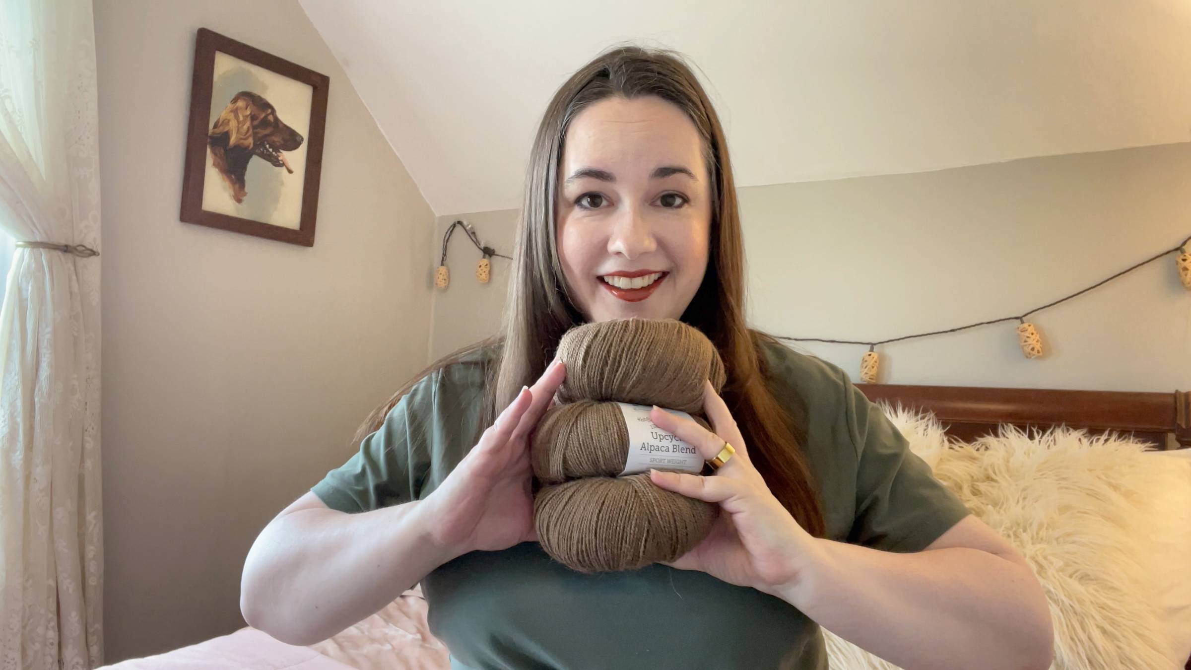 shannon talks yarn holding brown alpaca yarn