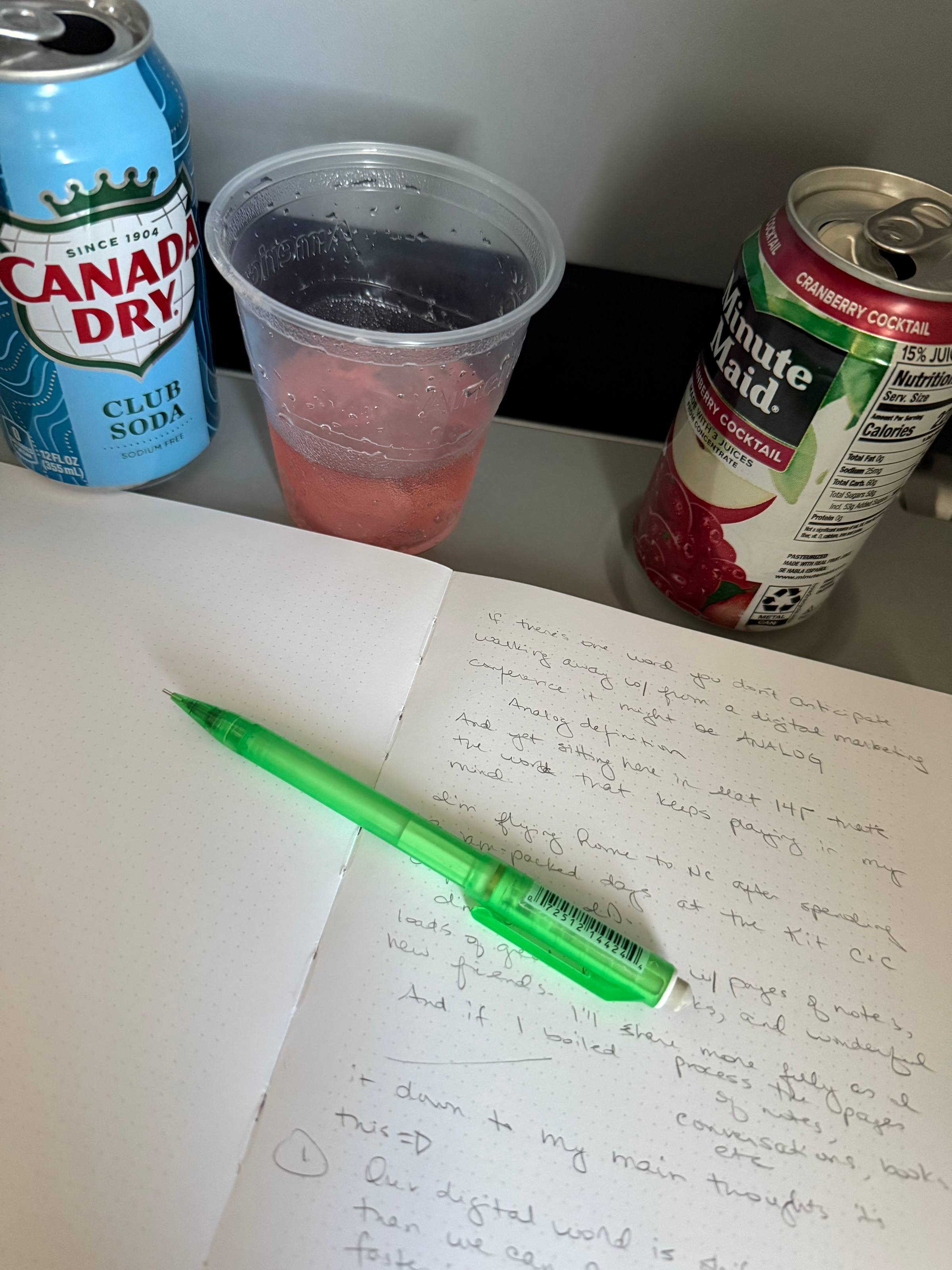 Open journal on an airplane tray table