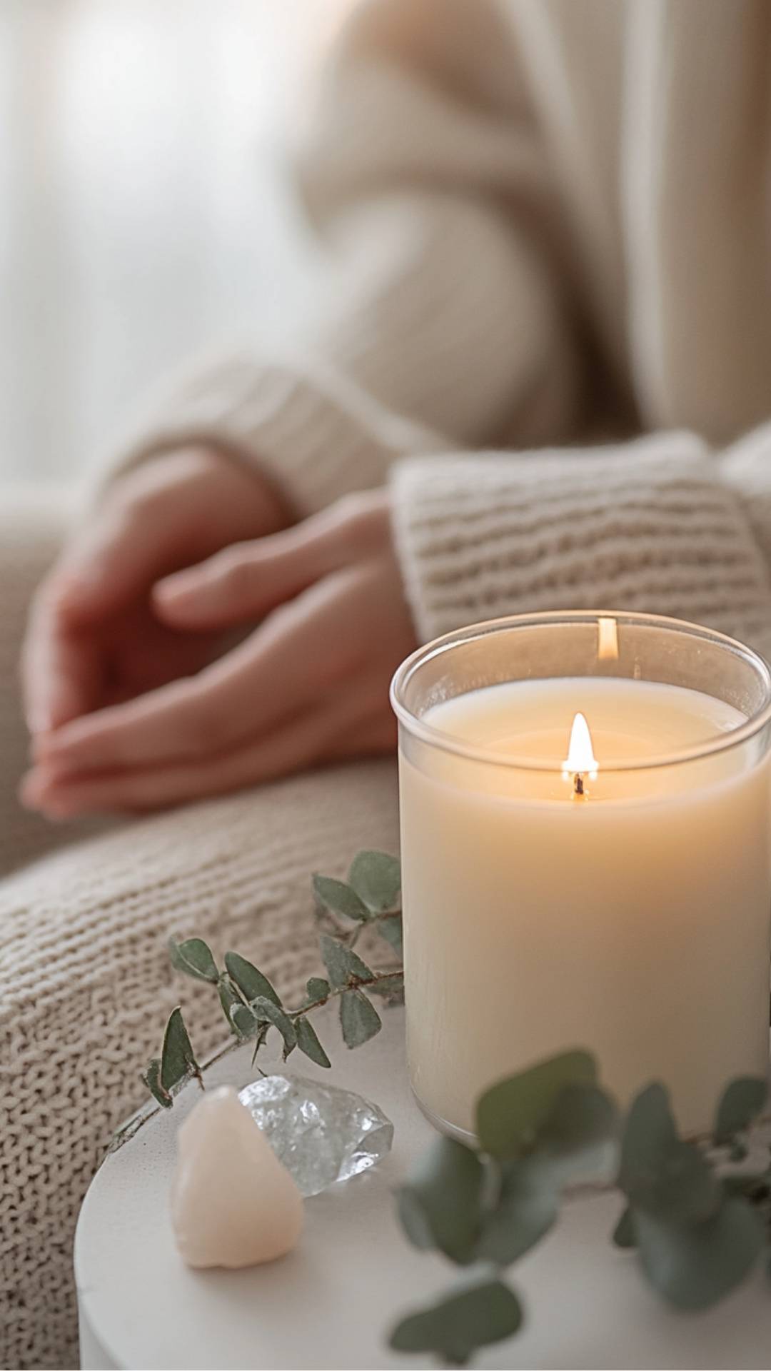 Woman sits relaxed with her eyes closed 