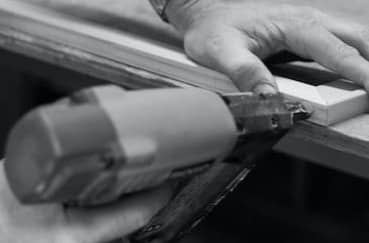 person doing wooden frame