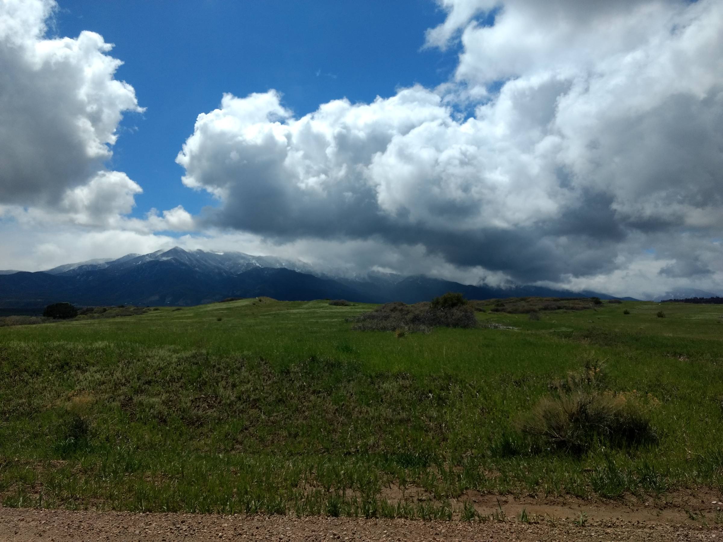 Snow on the mountains, green grass below, and wildly changeable weather are the hallmarks of spring in Colorado