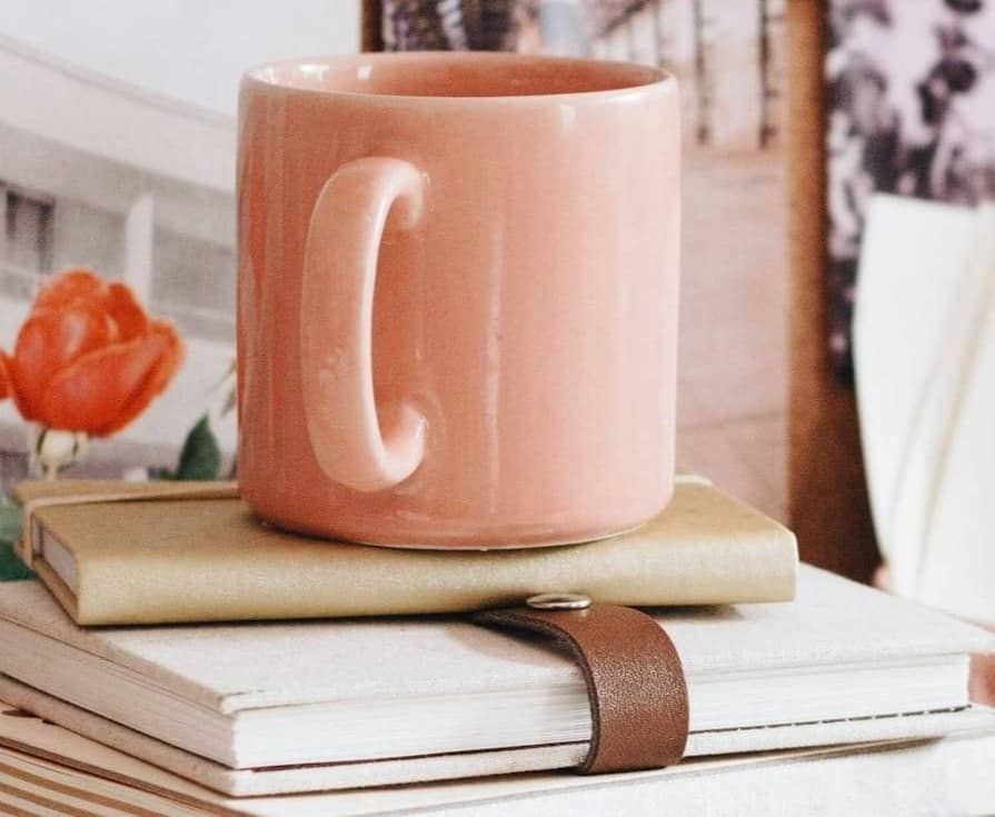 Coffee cup on books