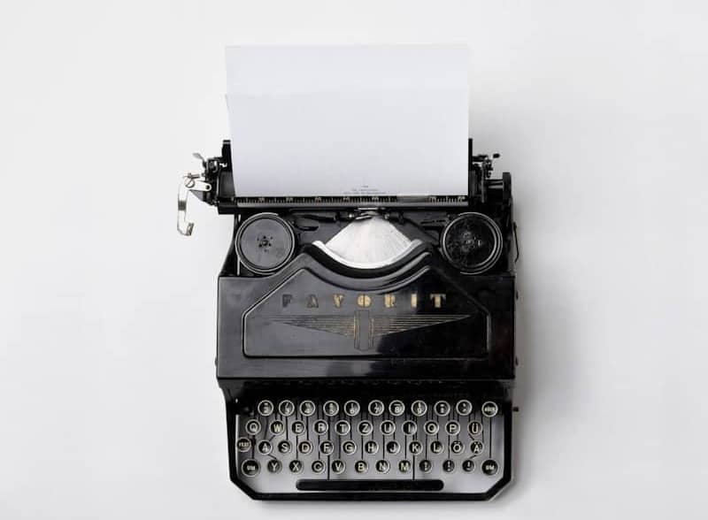 black Fayorit typewriter with printer paper