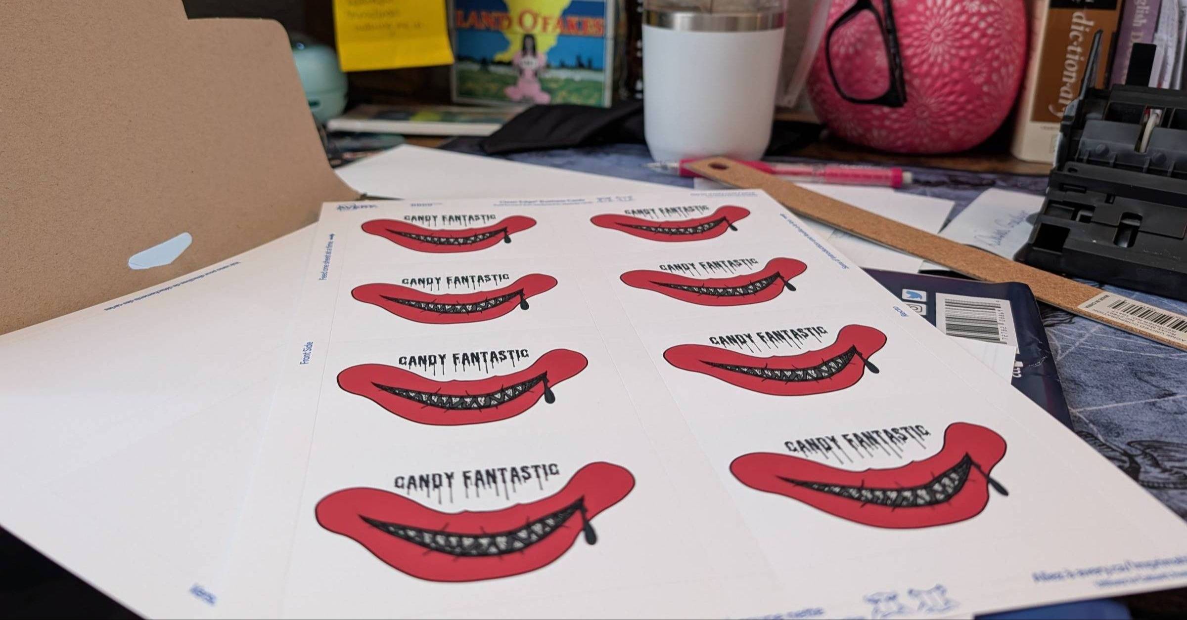 Candy Fantastic's red-lipped business cards arranged on her desk for the Colorado Festival of Horror