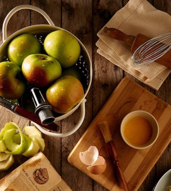 flat lay photography of mug on brown wooden chopping board