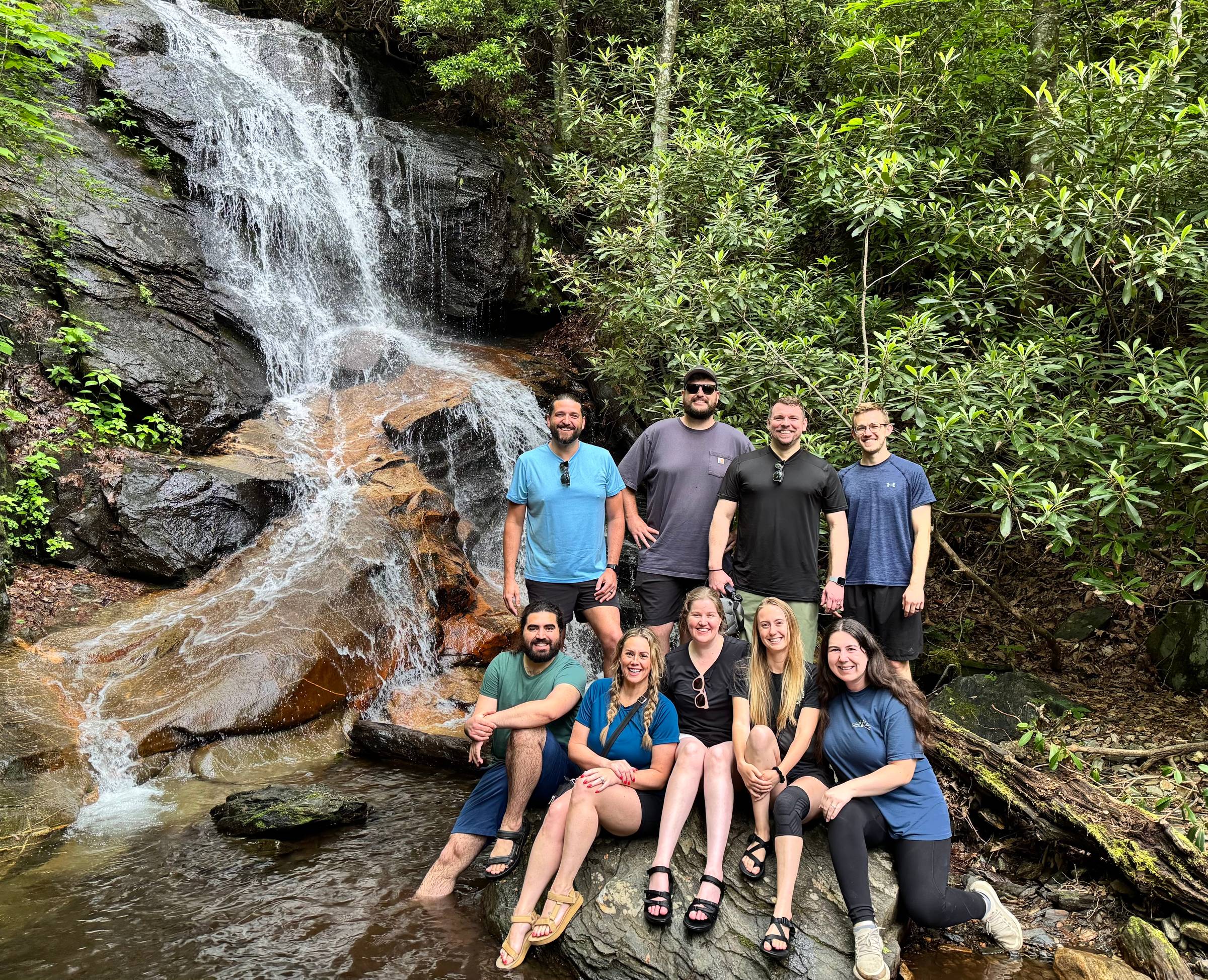 Travel creators at a waterfall in Asheville
