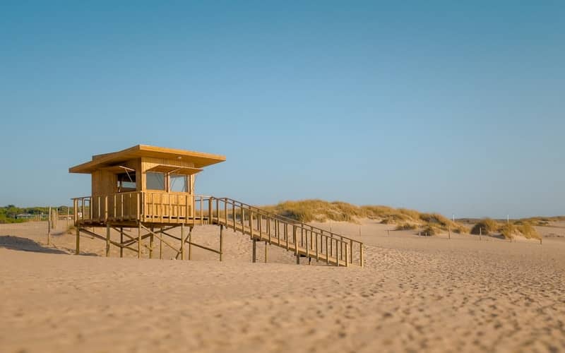 Wooden lifeguard tower on a sandy beach
