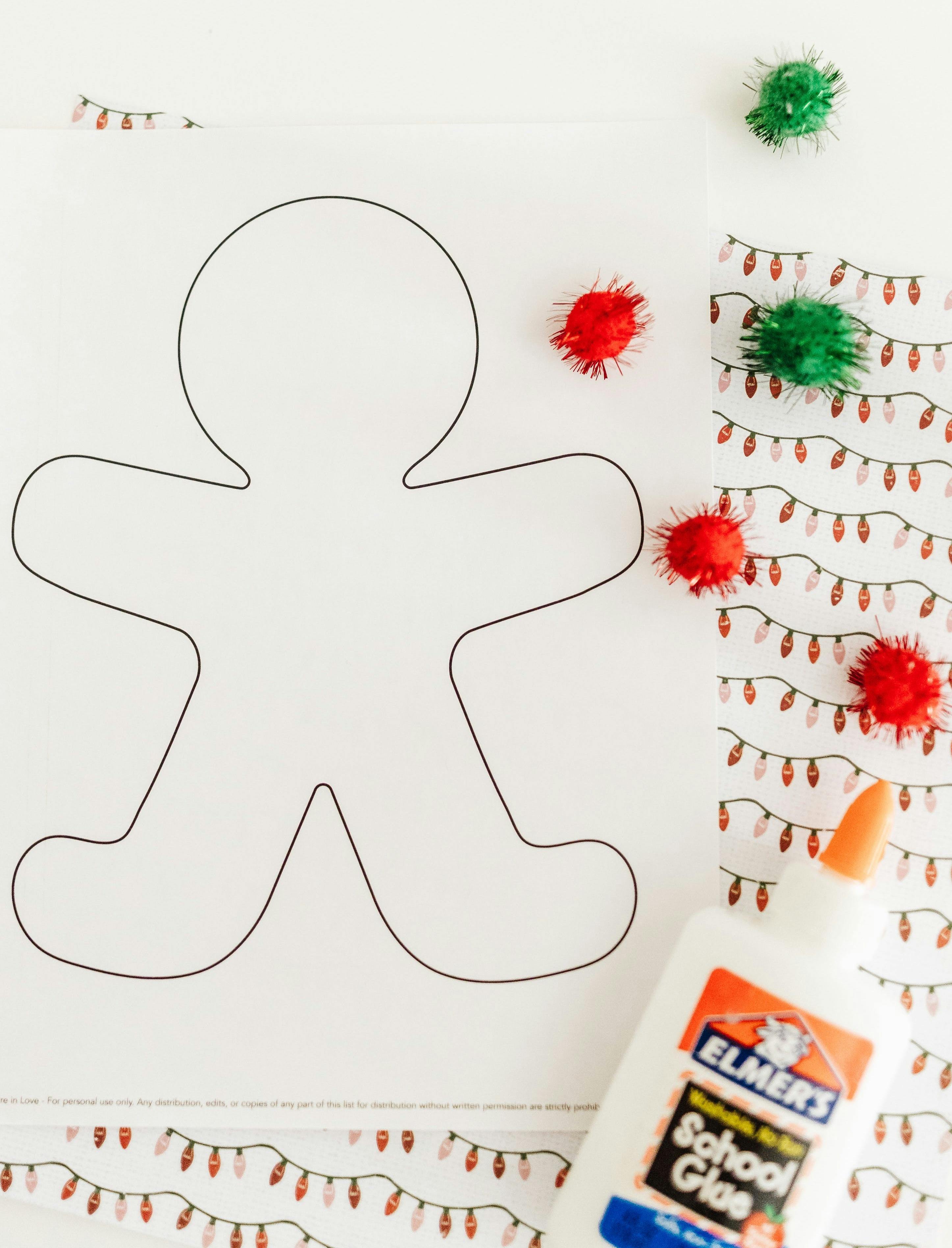 Gingerbread man template with craft supplies. 