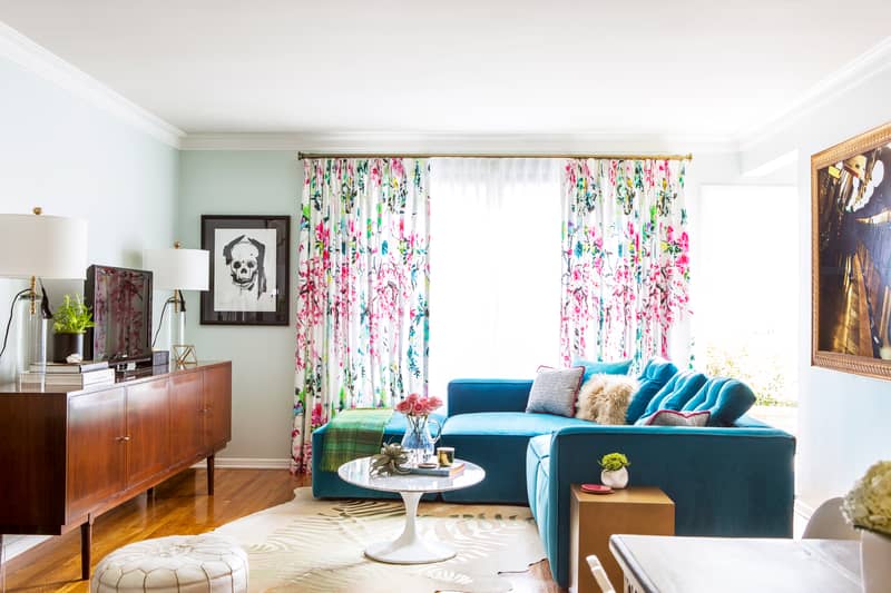 Bright and colorful living room with a teal sofa by Los Angeles and Fort Worth based interior designer Jessica McClendon