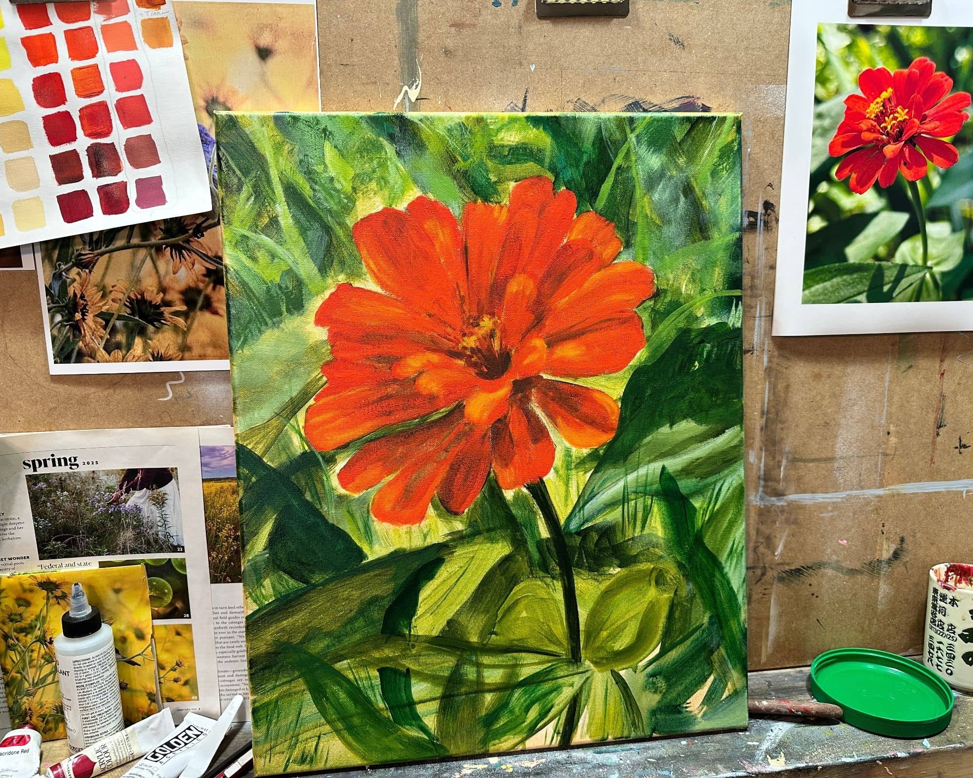a paint in progress of a zinnia