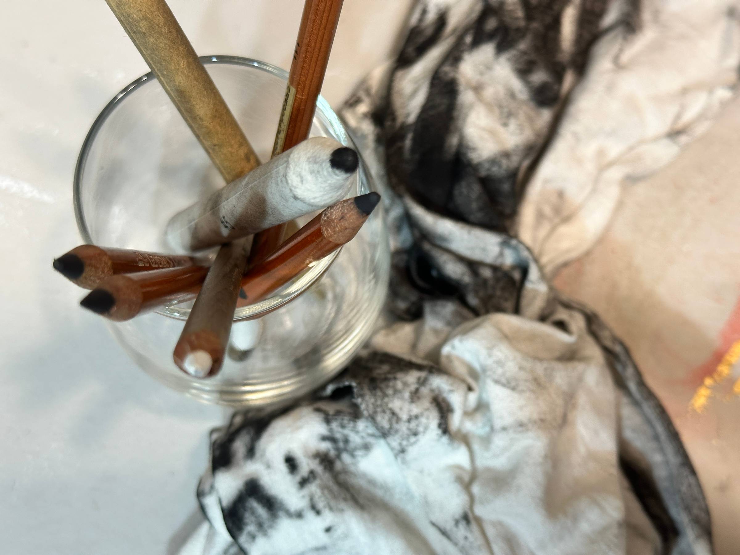 charcoal pencils and rag